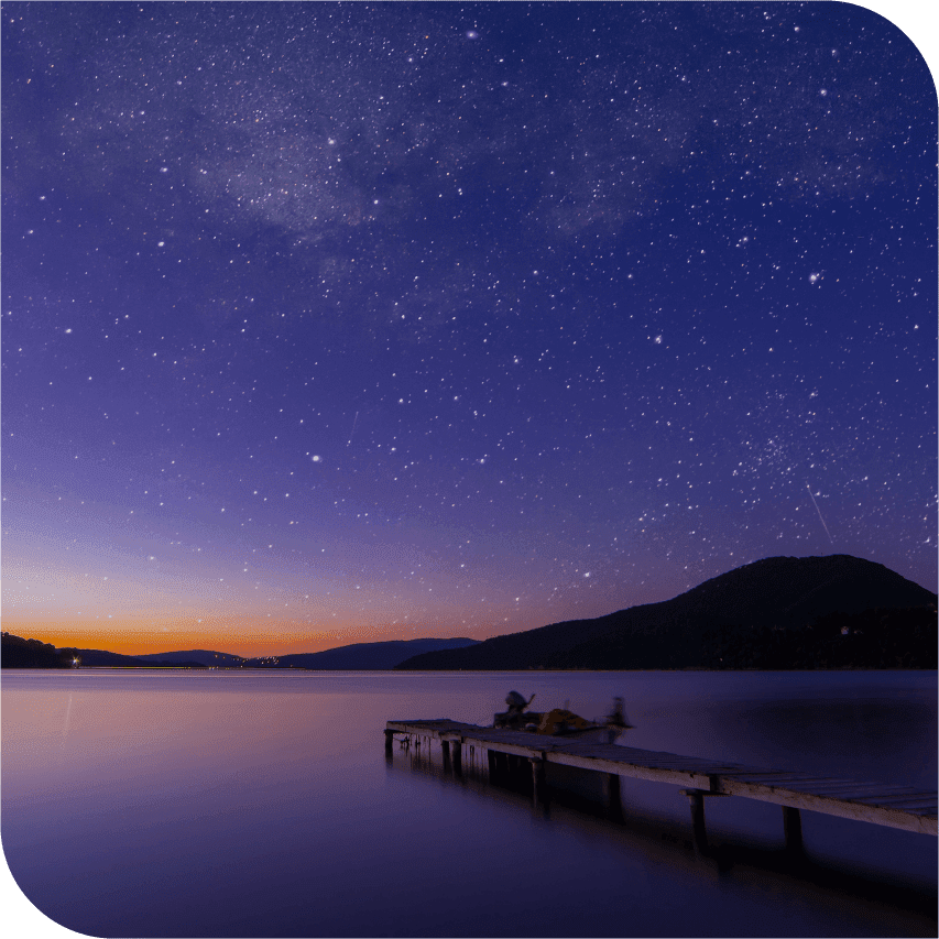 Lone dock with night sky in the background.